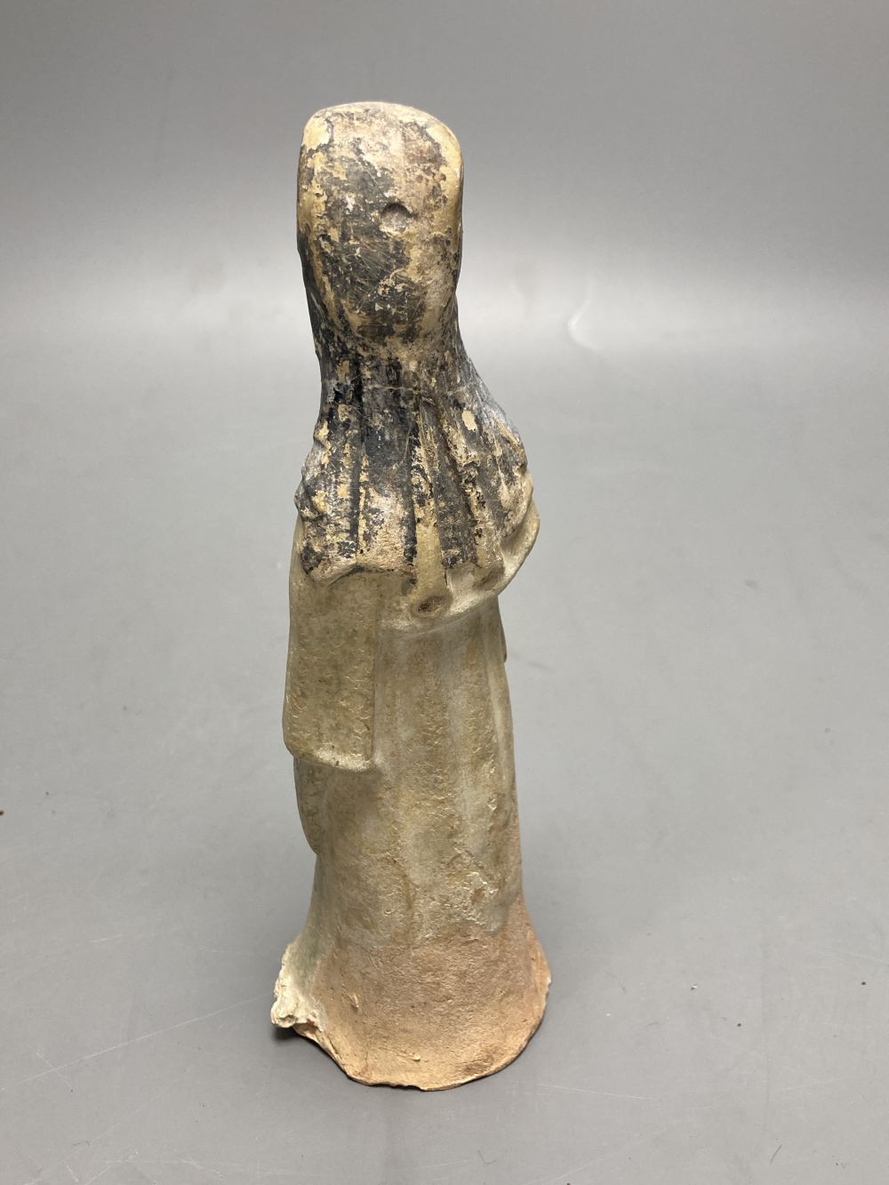 A Chinese part glazed pottery lady, Tang, height 20cm